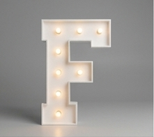 Wood marquee letter F, handmade with warm LED lighting for rent in Houston, TX and surrounding areas.