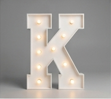 Wood marquee letter K, handmade with warm LED lighting for rent in Houston, TX and surrounding areas.