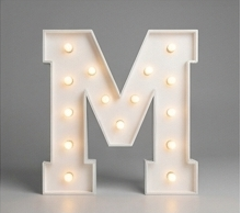 Wood marquee letter M, handmade with warm LED lighting for rent in Houston, TX and surrounding areas.