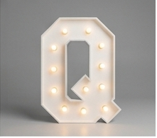 Wood marquee letter Q, handmade with warm LED lighting for rent in Houston, TX and surrounding areas.