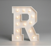 Wood marquee letter R, handmade with warm LED lighting for rent in Houston, TX and surrounding areas.