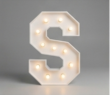 Wood marquee letter S, handmade with warm LED lighting for rent in Houston, TX and surrounding areas.