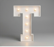 Wood marquee letter T, handmade with warm LED lighting for rent in Houston, TX and surrounding areas.