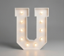 Wood marquee letter U, handmade with warm LED lighting for rent in Houston, TX and surrounding areas.