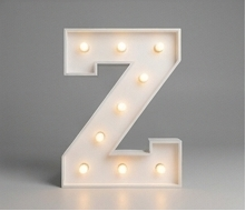 Wood marquee letter Z, handmade with warm LED lighting for rent in Houston, TX and surrounding areas.